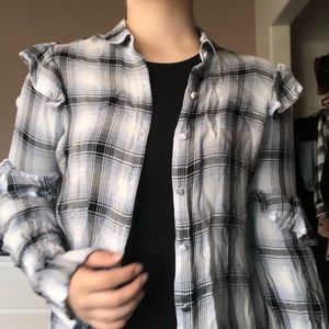 Light blue, black, and white, flannel top.